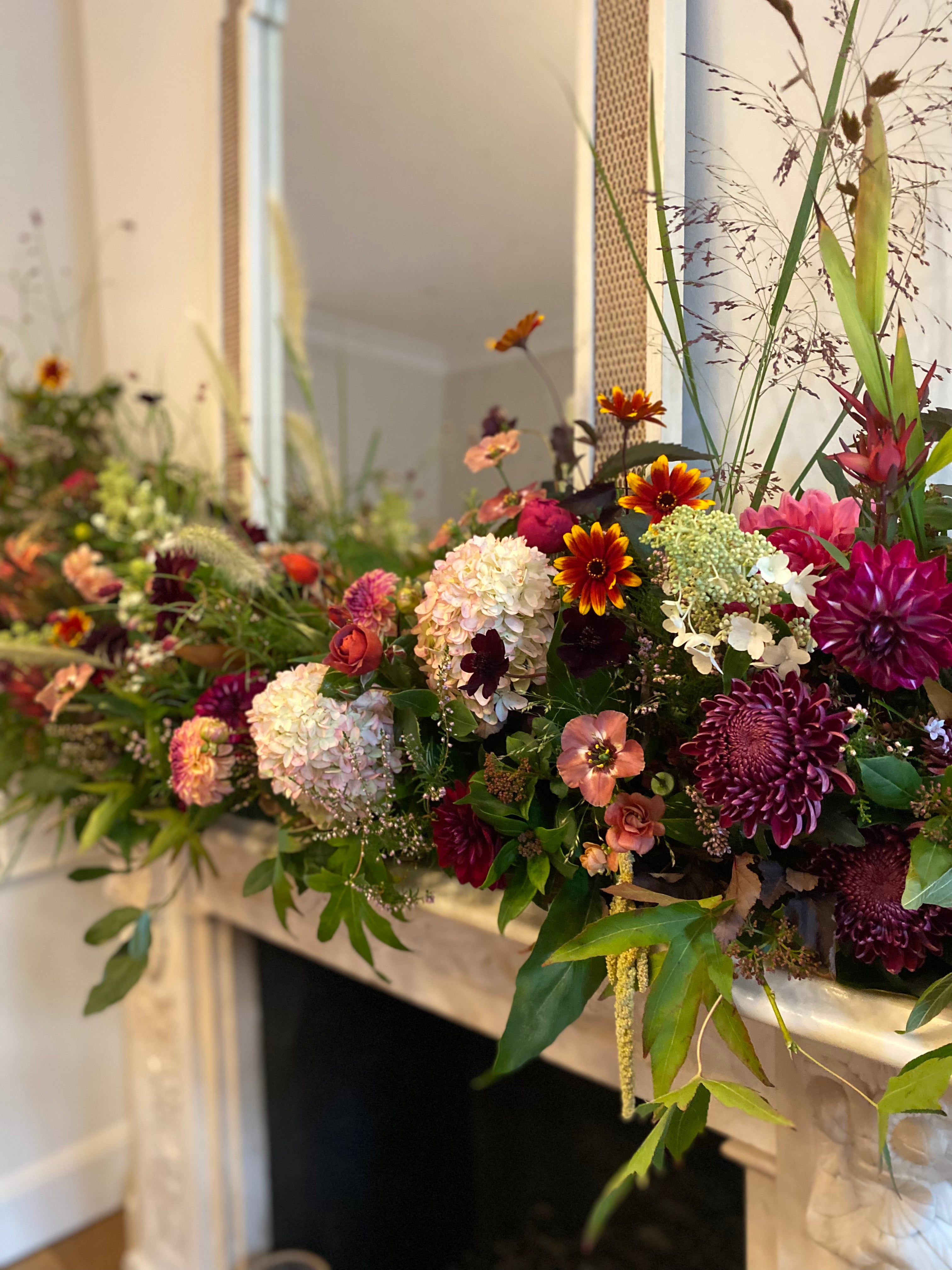 An abundant flower filled mantelpiece for an intimate At Home wedding in West London