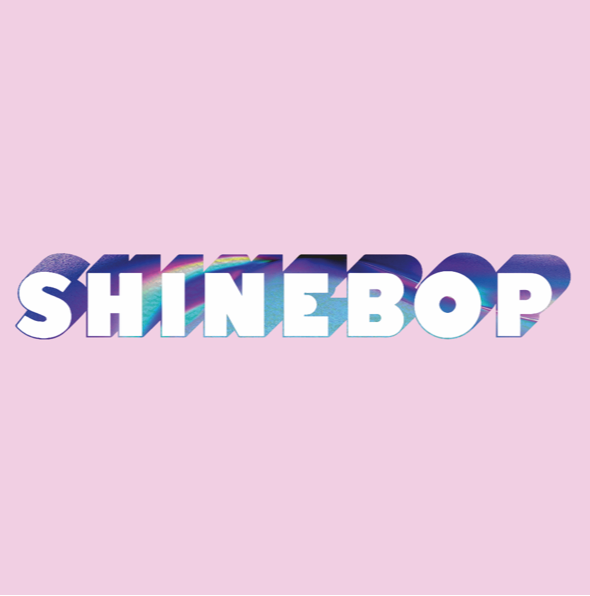 The word 'SHINEBOP' appears in large white letters with a holographic rainbow sheen and dark blue shadowing, centered on a solid light pink background.